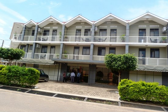 Madness in the Mountains: The Ultimate Mt. Rwenzori Marathon Guide & Where to Stay Modern hotel facade and amenities at TJ Global Hotel Kasese.