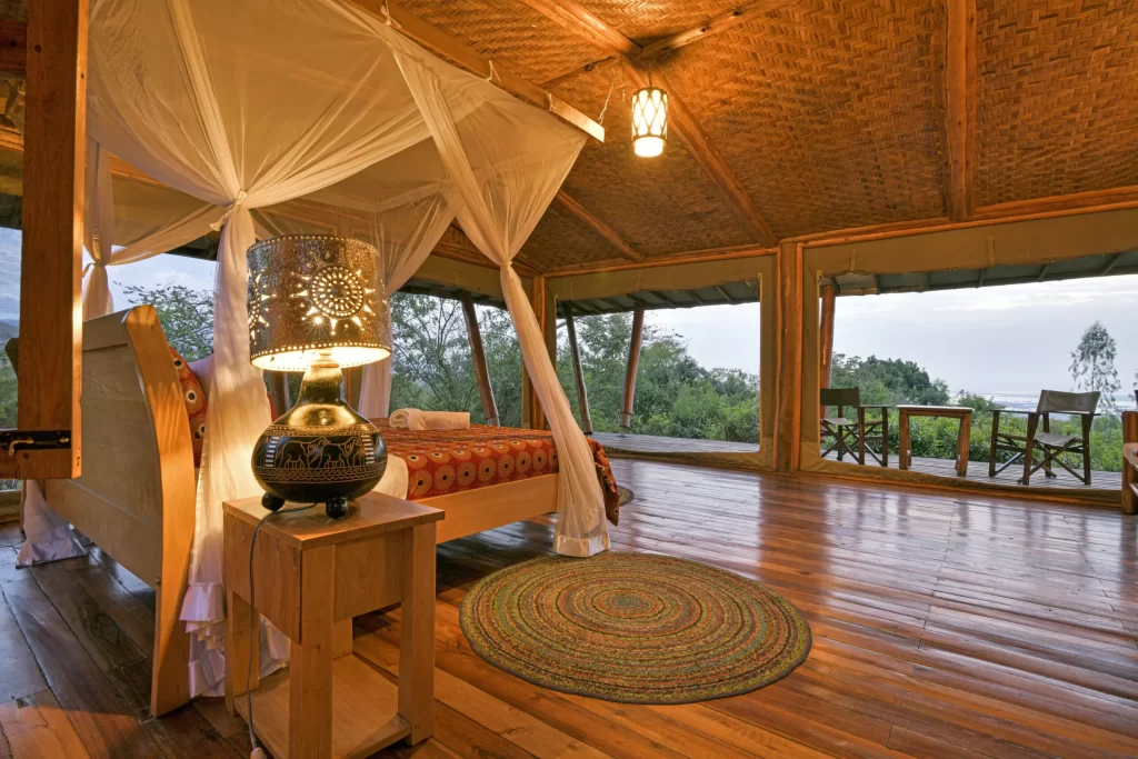 Interior view of a premium guest room at Marafiki Stays, showing a neatly made bed and African-themed decor.