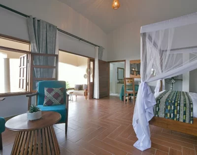 Madness in the Mountains: The Ultimate Mt. Rwenzori Marathon Guide & Where to Stay A beautiful view of one of Rwenzori International Hotel Bedroom with an African touch in the Fabrics.
