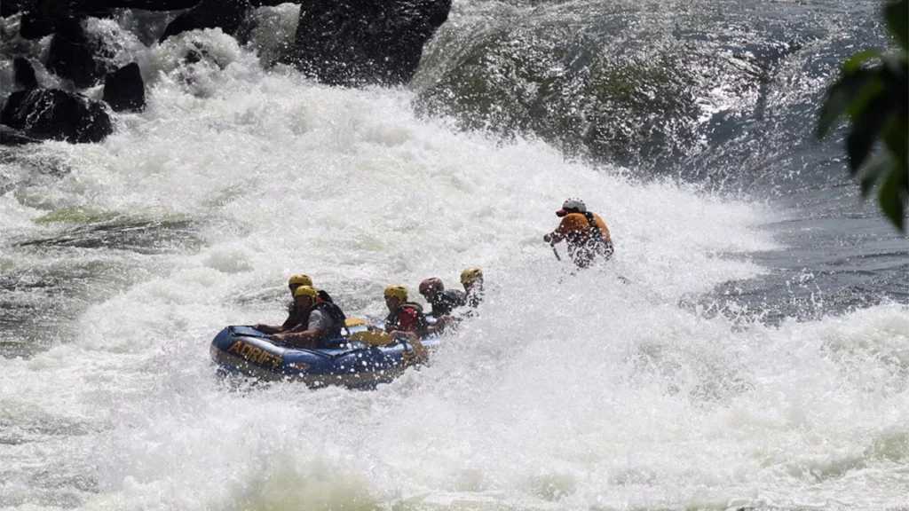 Jinja Adventure Guide 2026: 15 Insider Things to Do & Stays Adrift white water rafting team hitting a Grade 5 rapid in Jinja Uganda.